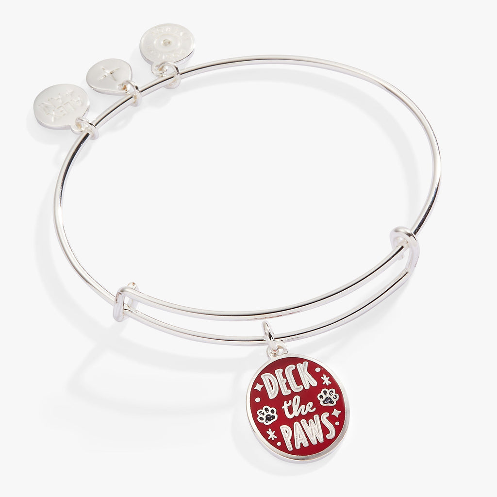 Silver wire bangle with an epoxy charm saying Deck the Paws, featuring red and white paw print details.