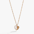 Heart-shaped charm necklace with Mother of Pearl and angel wing detail featuring glass crystals.