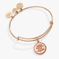 Good Things Are Coming mantra charm bangle with clear crystal accent on an expandable wire bracelet