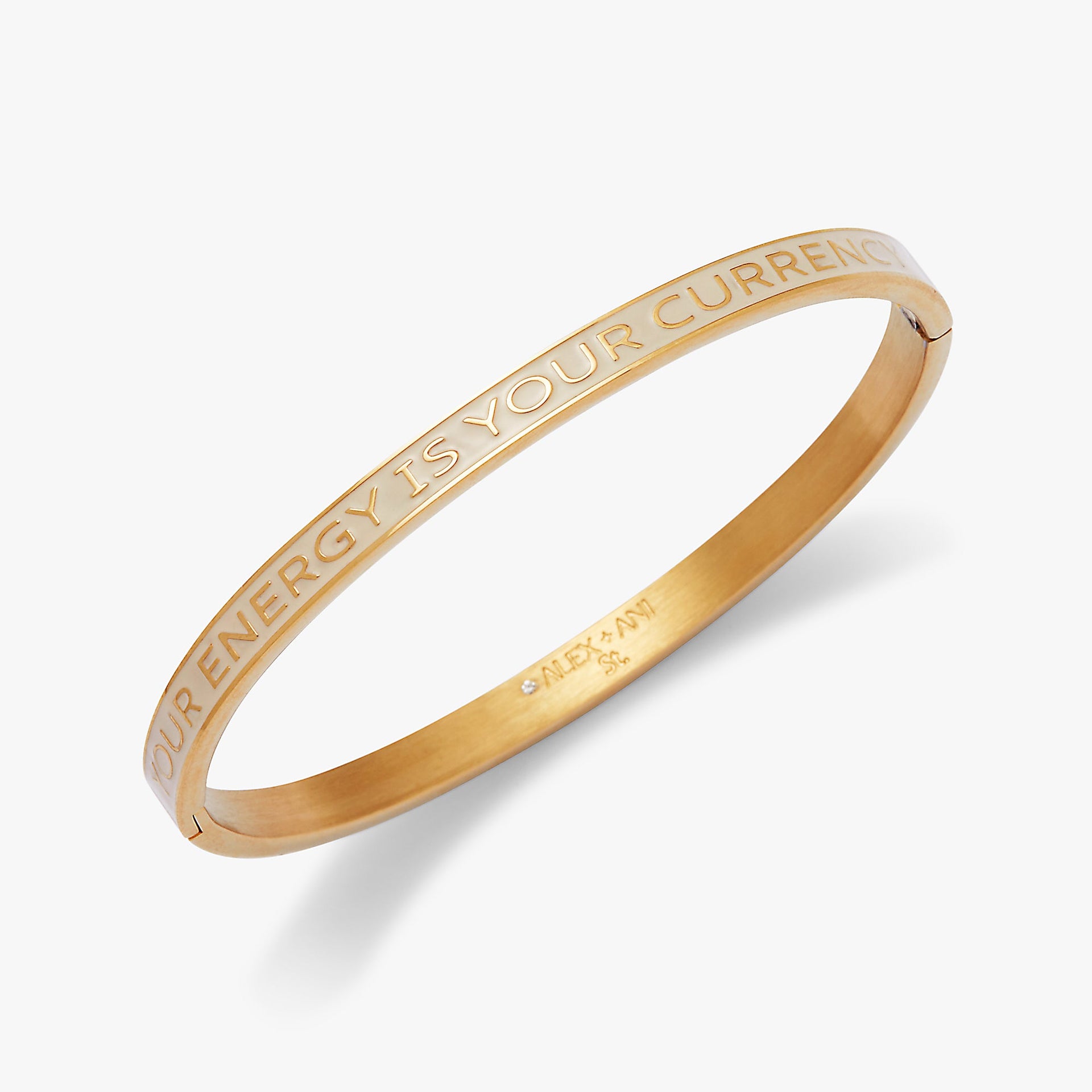 Neutral enamel hinge bangle featuring the mantra Your Energy Is Your Currency in bold block lettering.