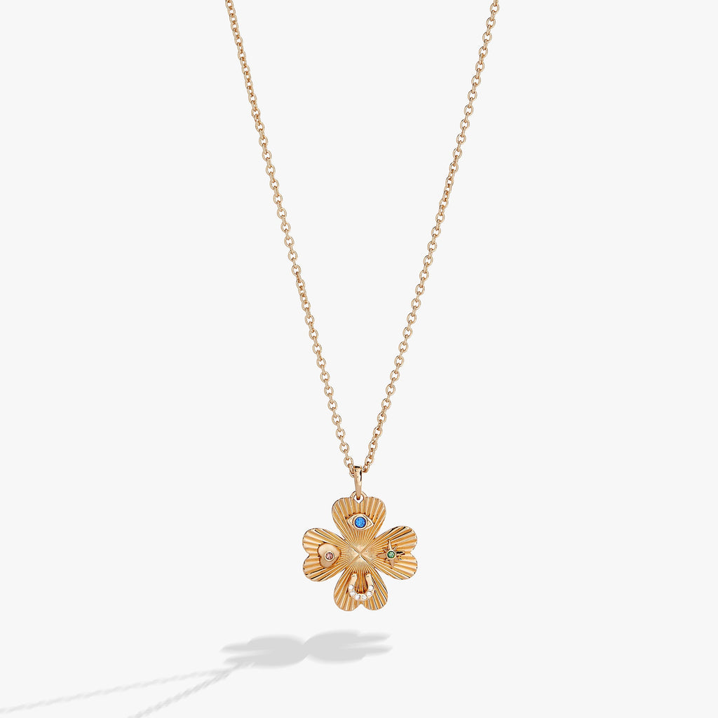 Elegant adjustable four-leaf clover pendant necklace representing good luck.