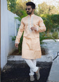 Toddler boy wearing an orange shiny silk kurta and matching pajama set with coding embroidery