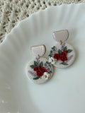 Romantic Emma earrings with floral patterns in white, red, and green