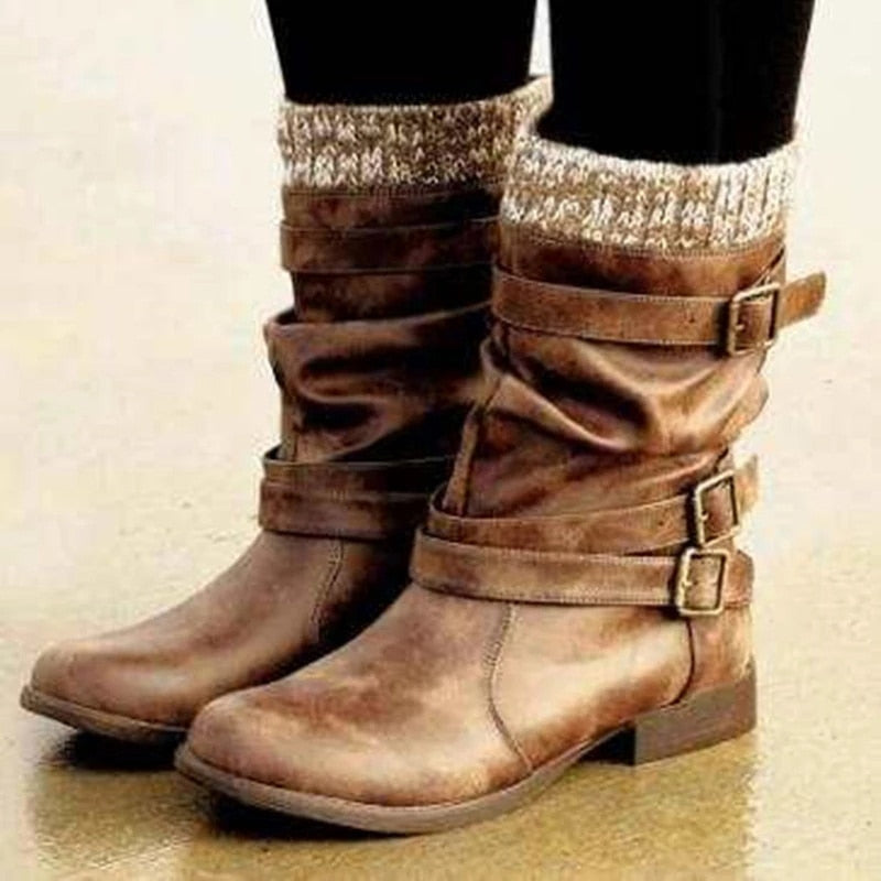 A pair of women's retro brown mid-calf boots with chunky heels, multiple buckles, and a knit cuff worn with black leggings. Another image shows the black variation with dark grey jeans.