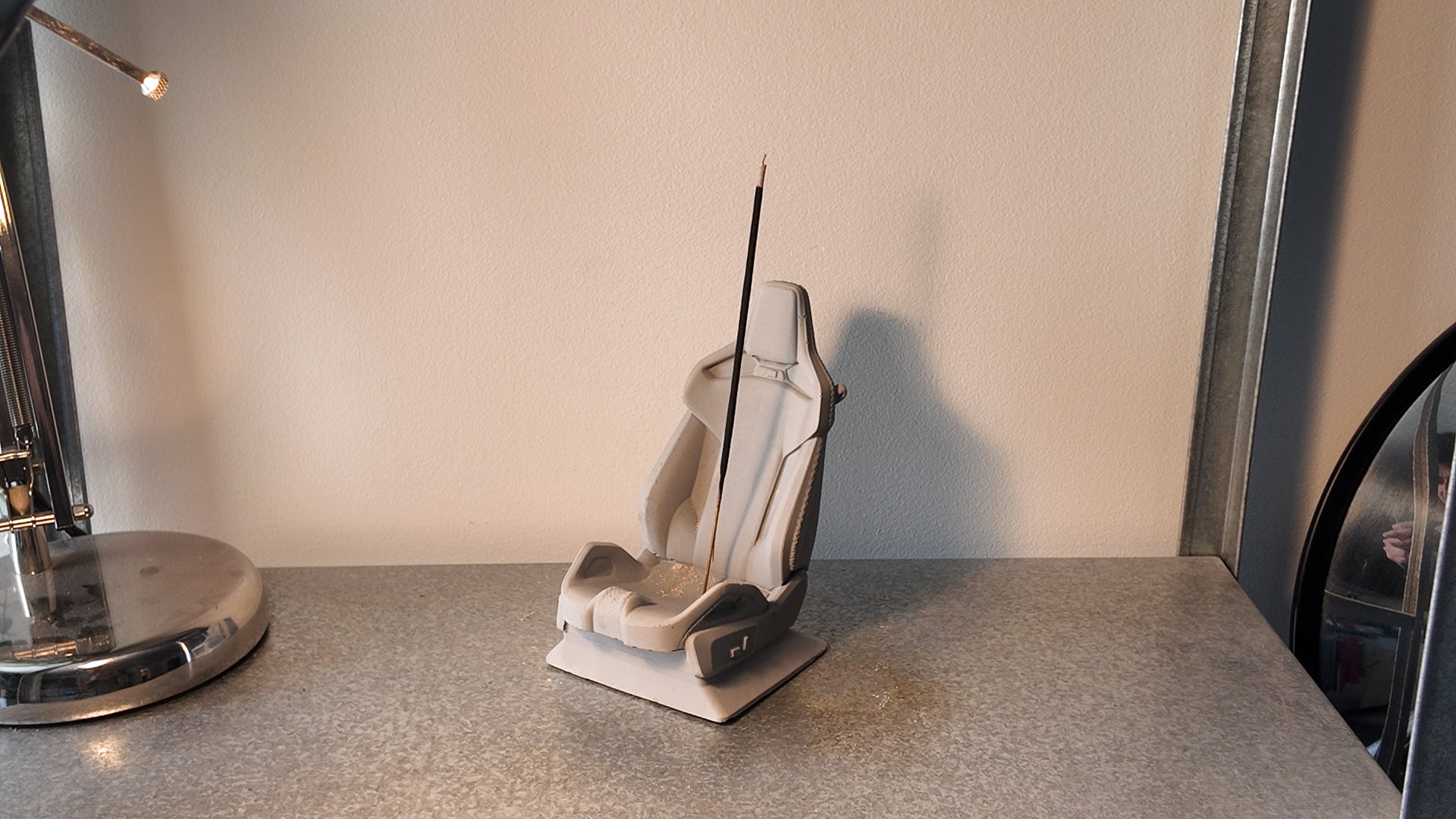 Grey and white concrete bucket seat style incense holder
