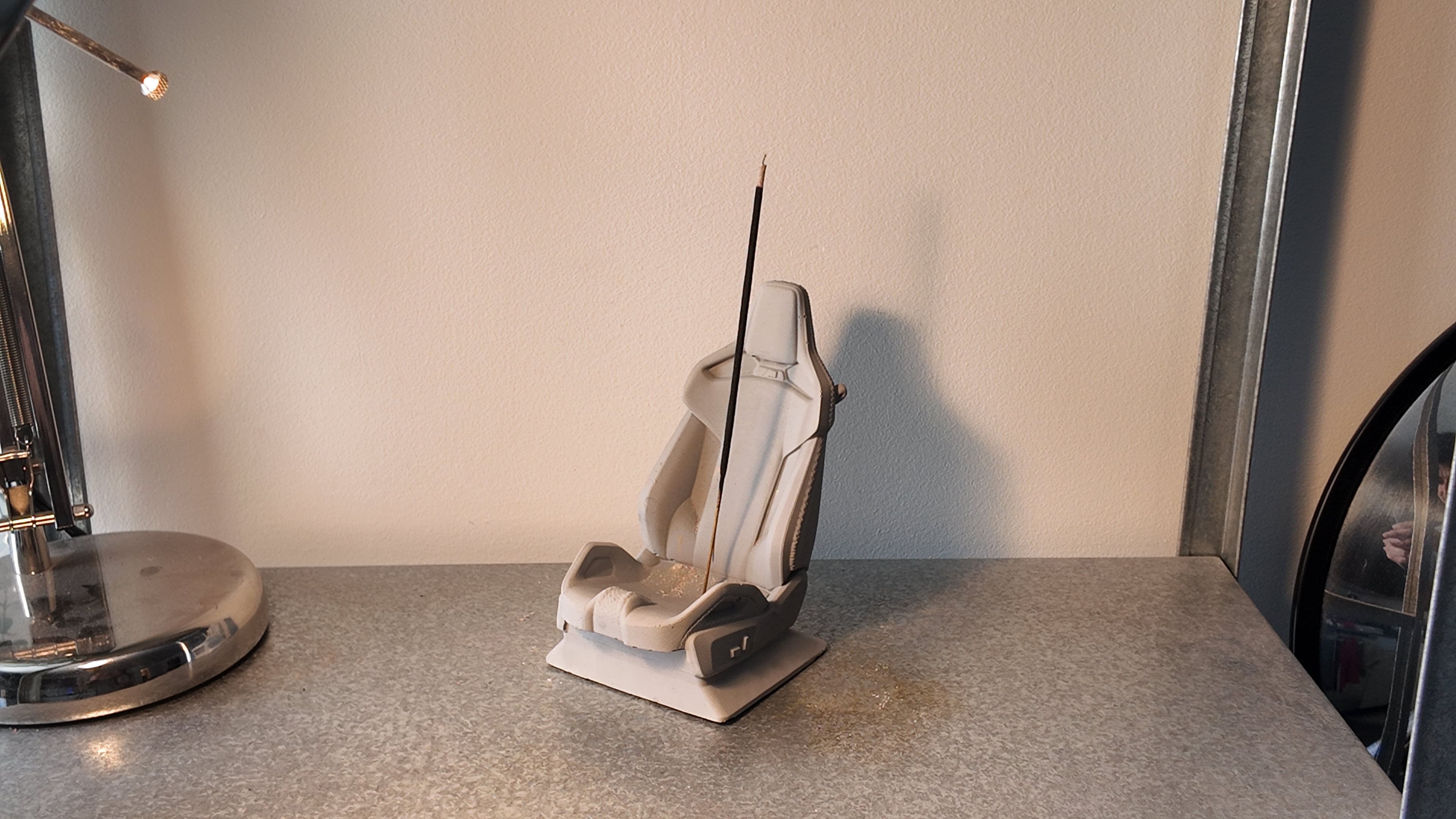 Grey and white concrete bucket seat style incense holder