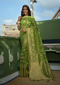 Parrot Green Organza Silk saree with weaving and tassels