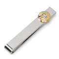 Silver tie bar with gold 9mm bullet casing detail clipped onto a black tie.