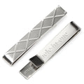 Silver tone tie bar with argyle pattern on the front and Hole-in-One engraved on the back.
