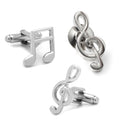 Silver-tone music note cufflinks and a treble clef lapel pin displayed in a black gift box.