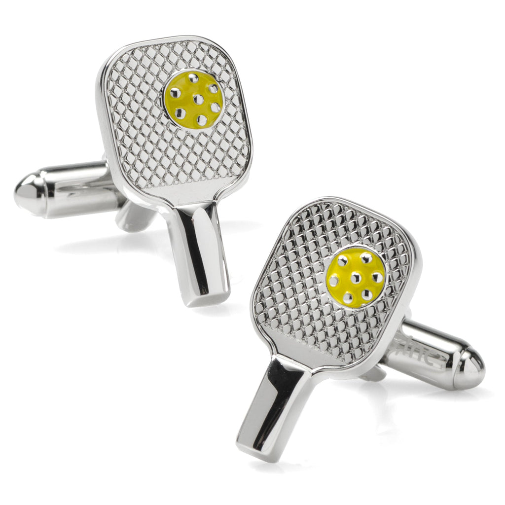 A pair of silver-toned pickleball racket cufflinks featuring a small yellow pickleball accent, shown against a white background.