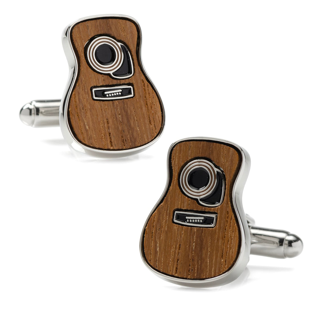 A pair of acoustic guitar shaped cufflinks with a natural wood face and silver metal trim on a white shirt cuff.