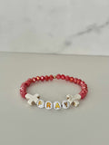 Pray Red Faceted Beaded Bracelet showing the letters P-R-A-Y on the bead sequence.