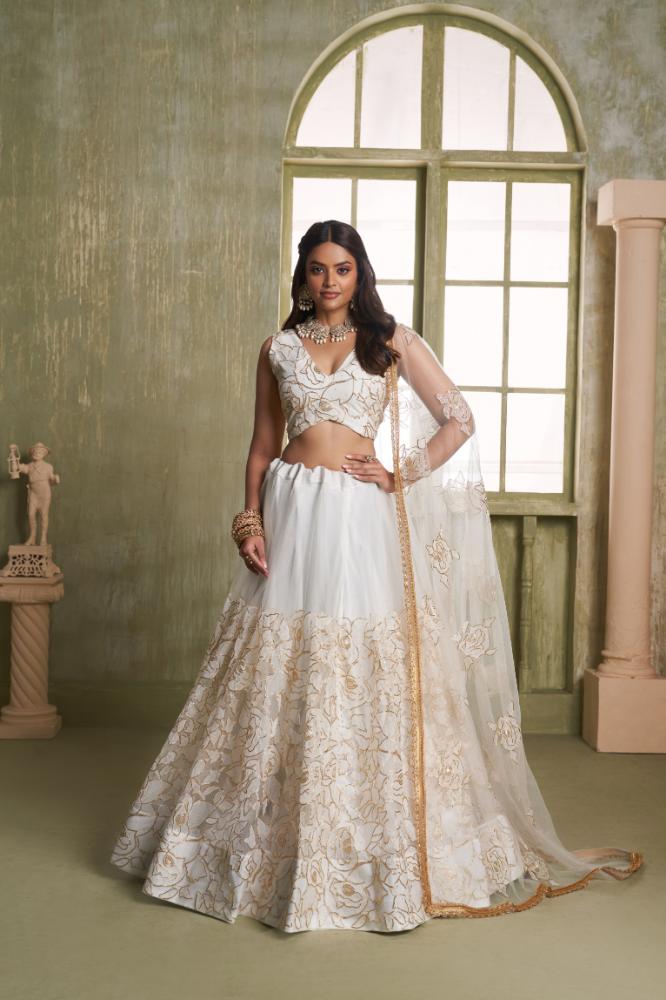 White Butterfly Net wedding lehenga choli with delicate cotton thread and sequence embroidery.