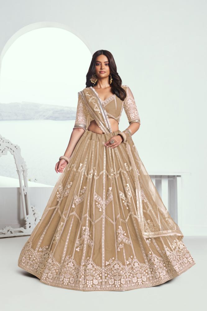 Chiku beige butterfly net lehenga choli with intricate white embroidery for weddings.