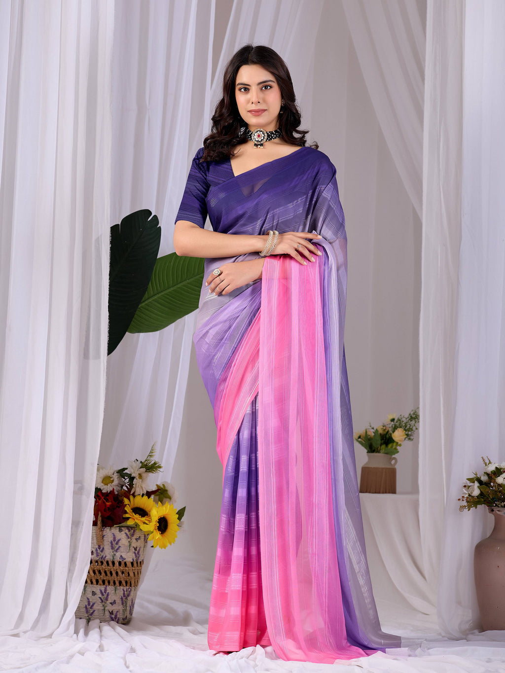 Aastha Fashion multi-colored monsoon print saree with a contrast purple blouse piece