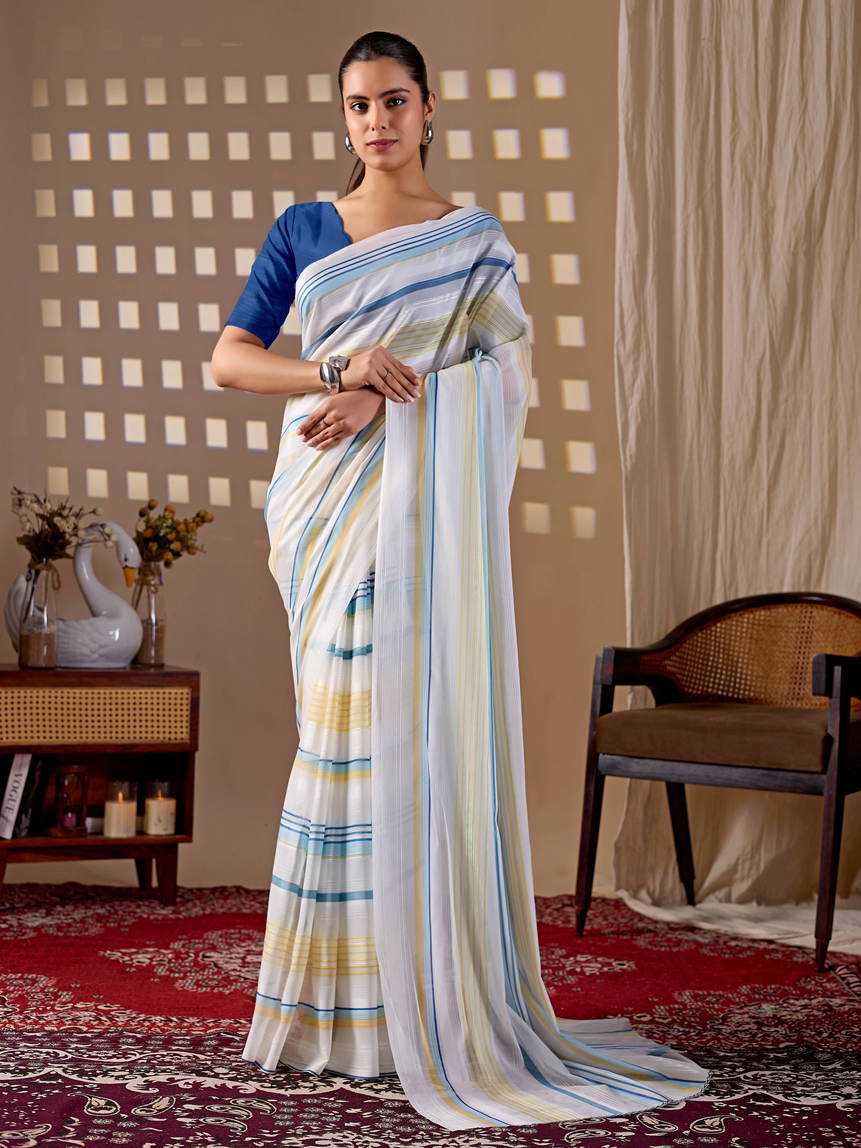 White monsoon printed saree with a blue blouse piece