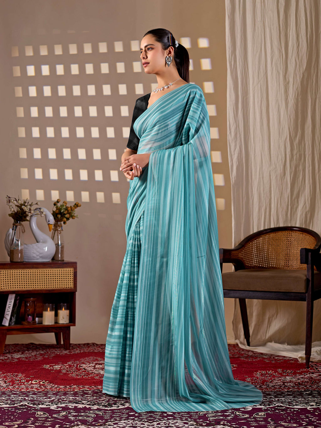 See green monsoon printed saree paired with a black blouse