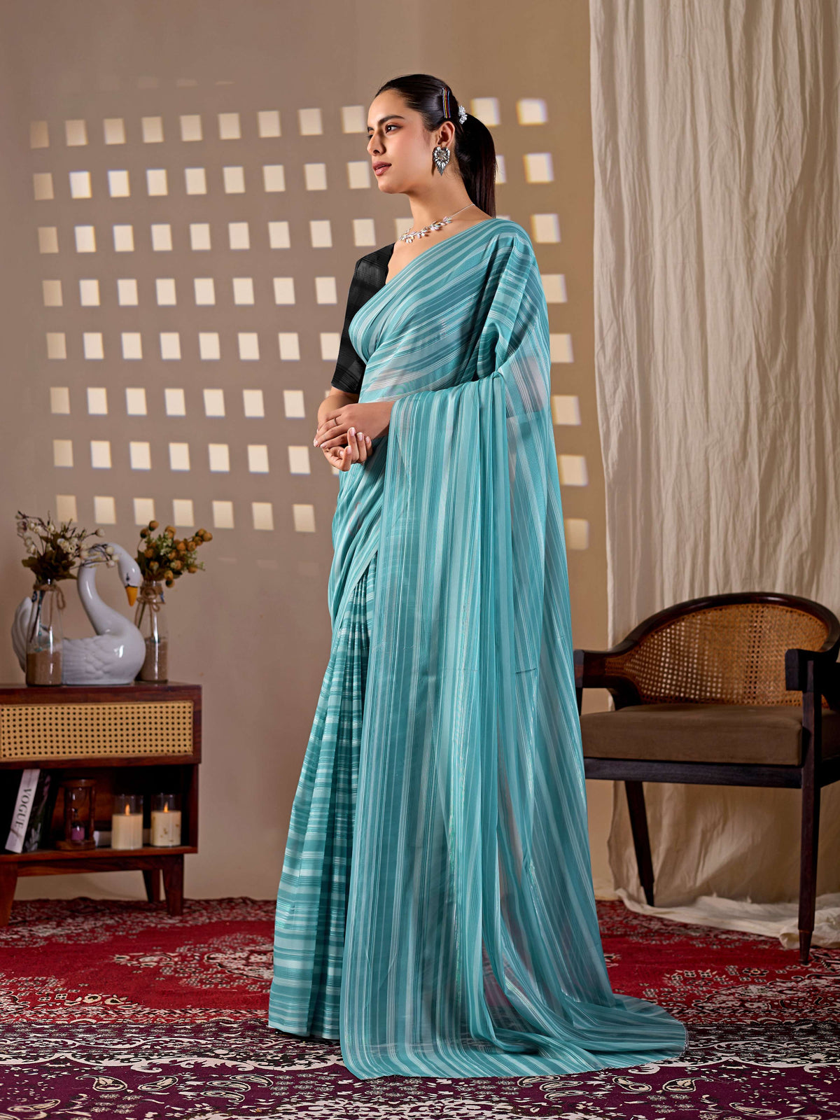See green monsoon printed saree paired with a black blouse