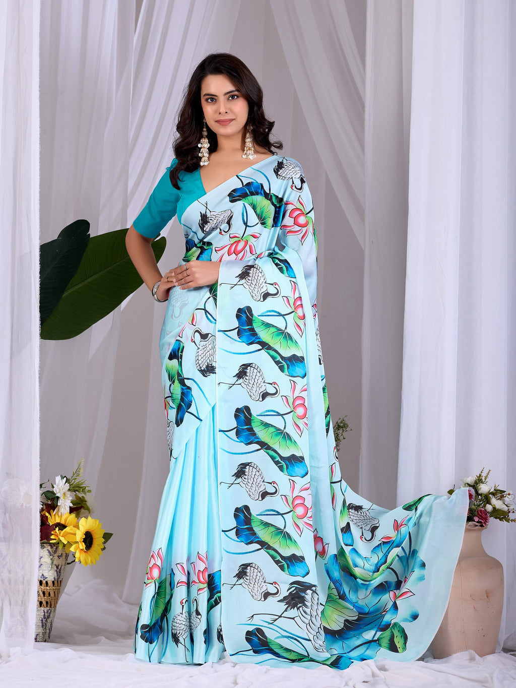 See green soft satin saree with floral digital prints and aqua blouse