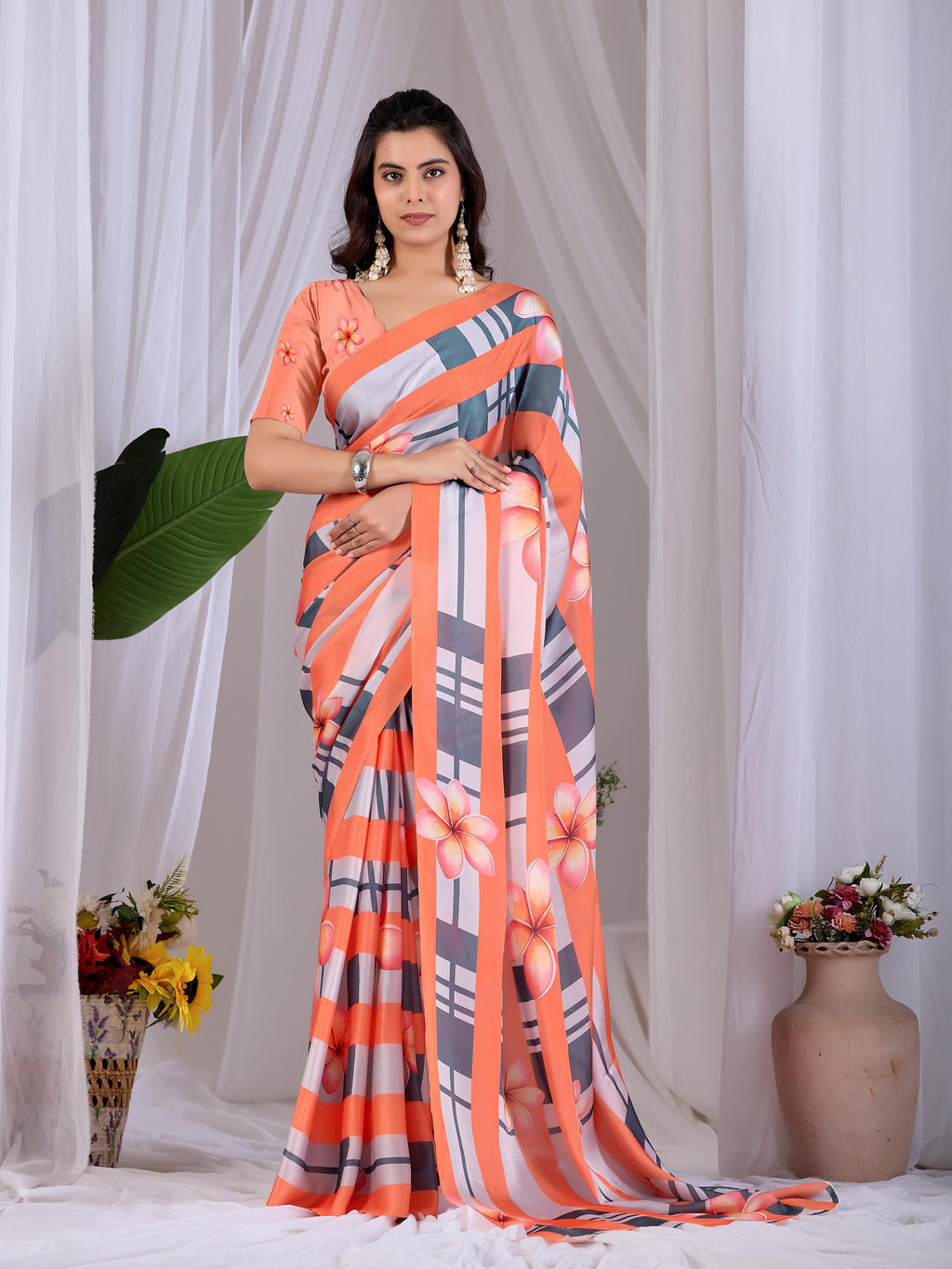 A vibrant Multi-Color soft satin georgette printed saree with a contrasting Peach blouse