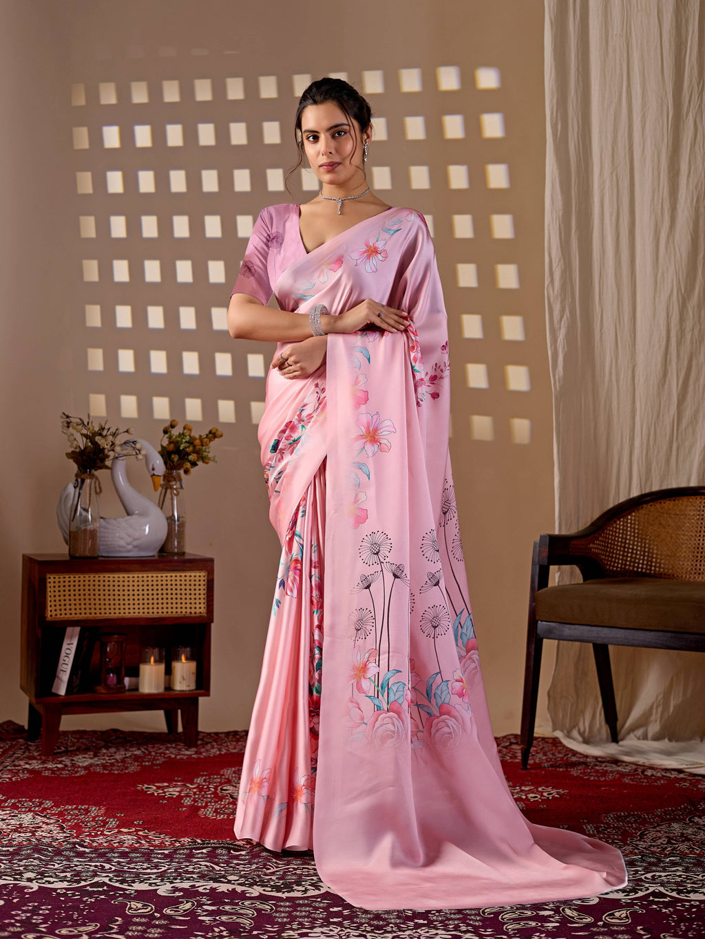 Elegant Pink soft satin georgette printed saree with a matching blouse.
