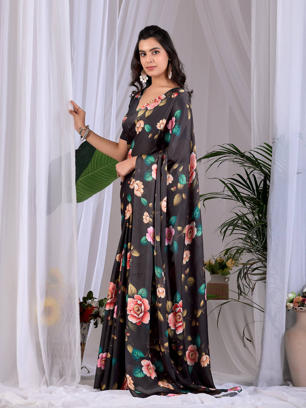 Elegant black printed soft satin georgette saree with matching blouse
