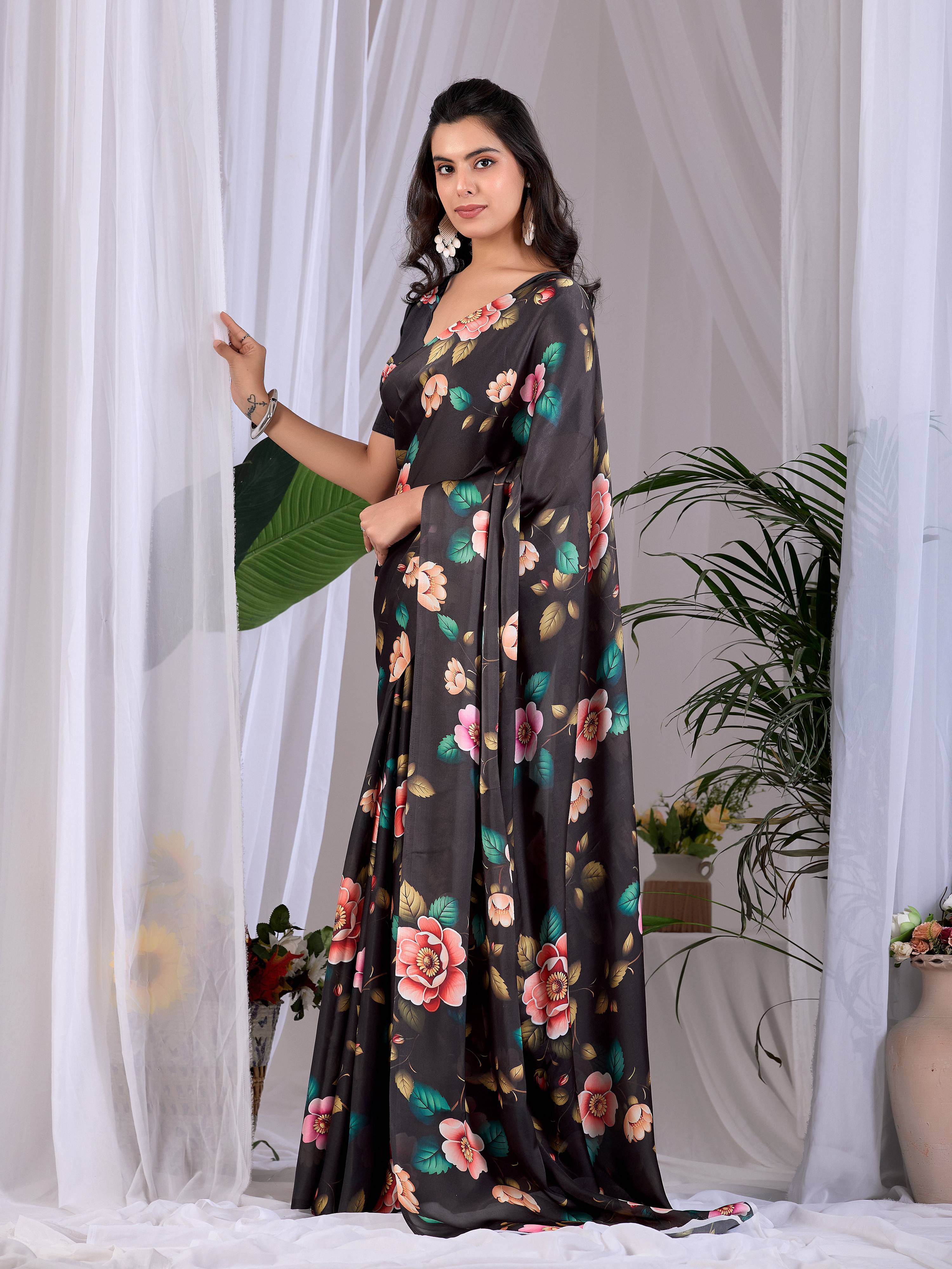 Elegant black printed soft satin georgette saree with matching blouse