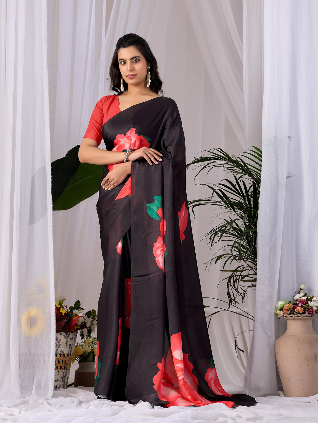 Black soft satin georgette printed saree with contrasting red blouse