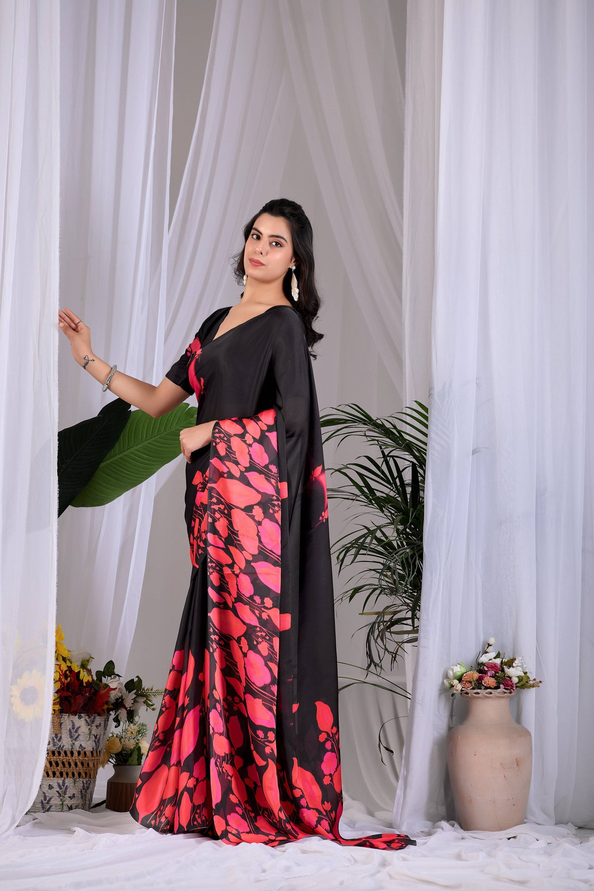 Aastha Fashion multi-colored soft satin georgette printed saree with a solid black blouse fabric