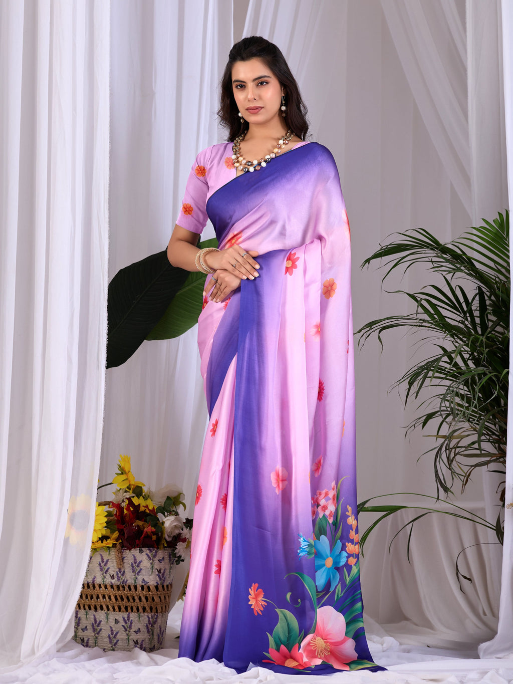 A stunning Pink soft satin georgette printed saree with delicate finish.