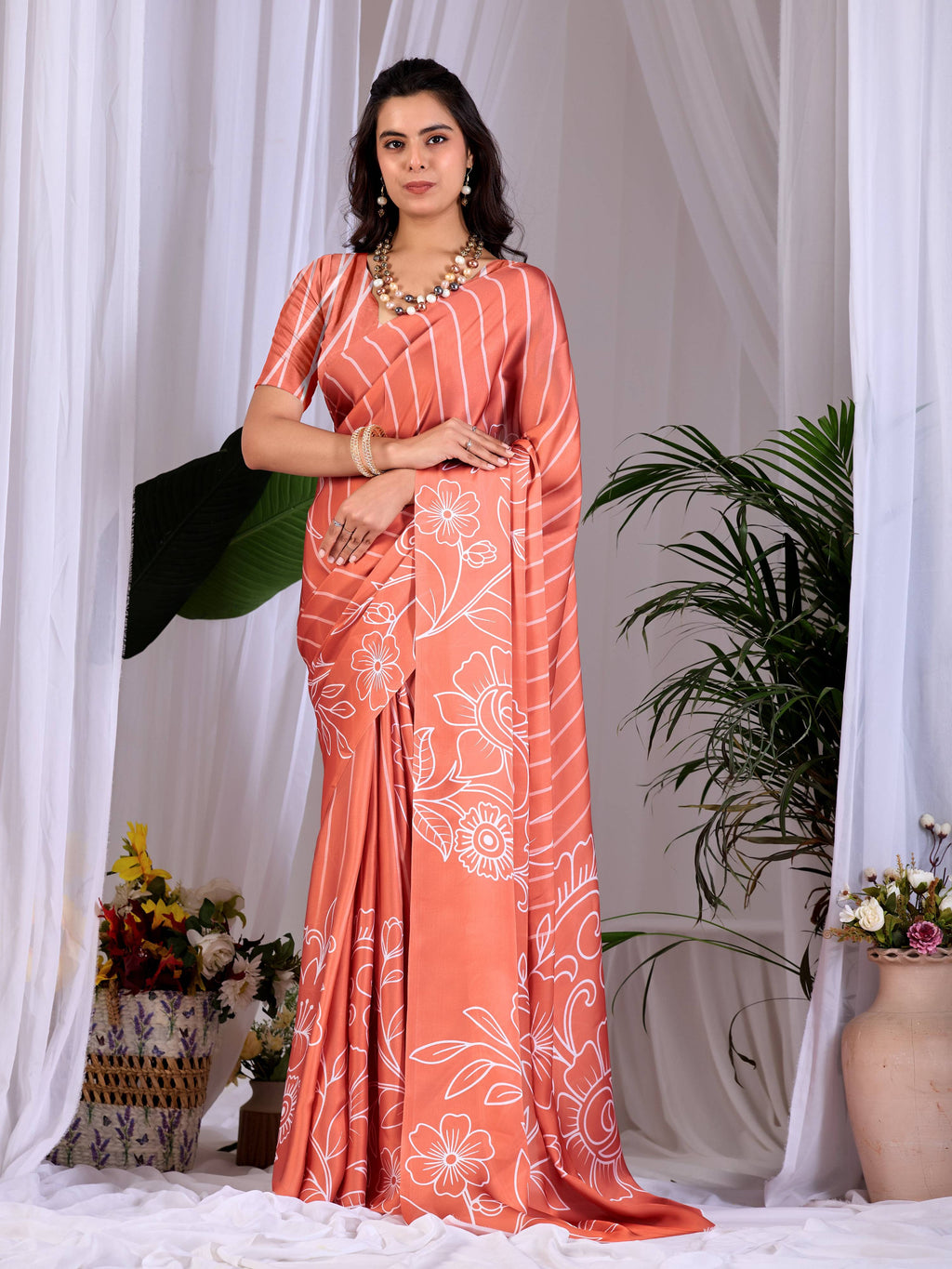Rust colored soft satin georgette printed saree with matching blouse piece