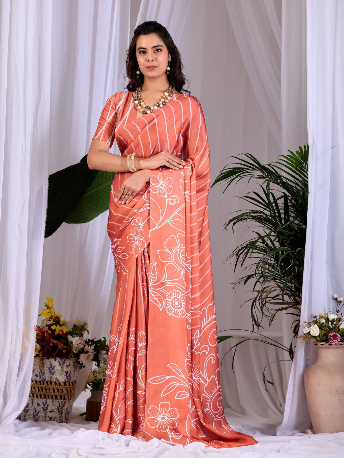 Rust colored soft satin georgette printed saree with matching blouse piece