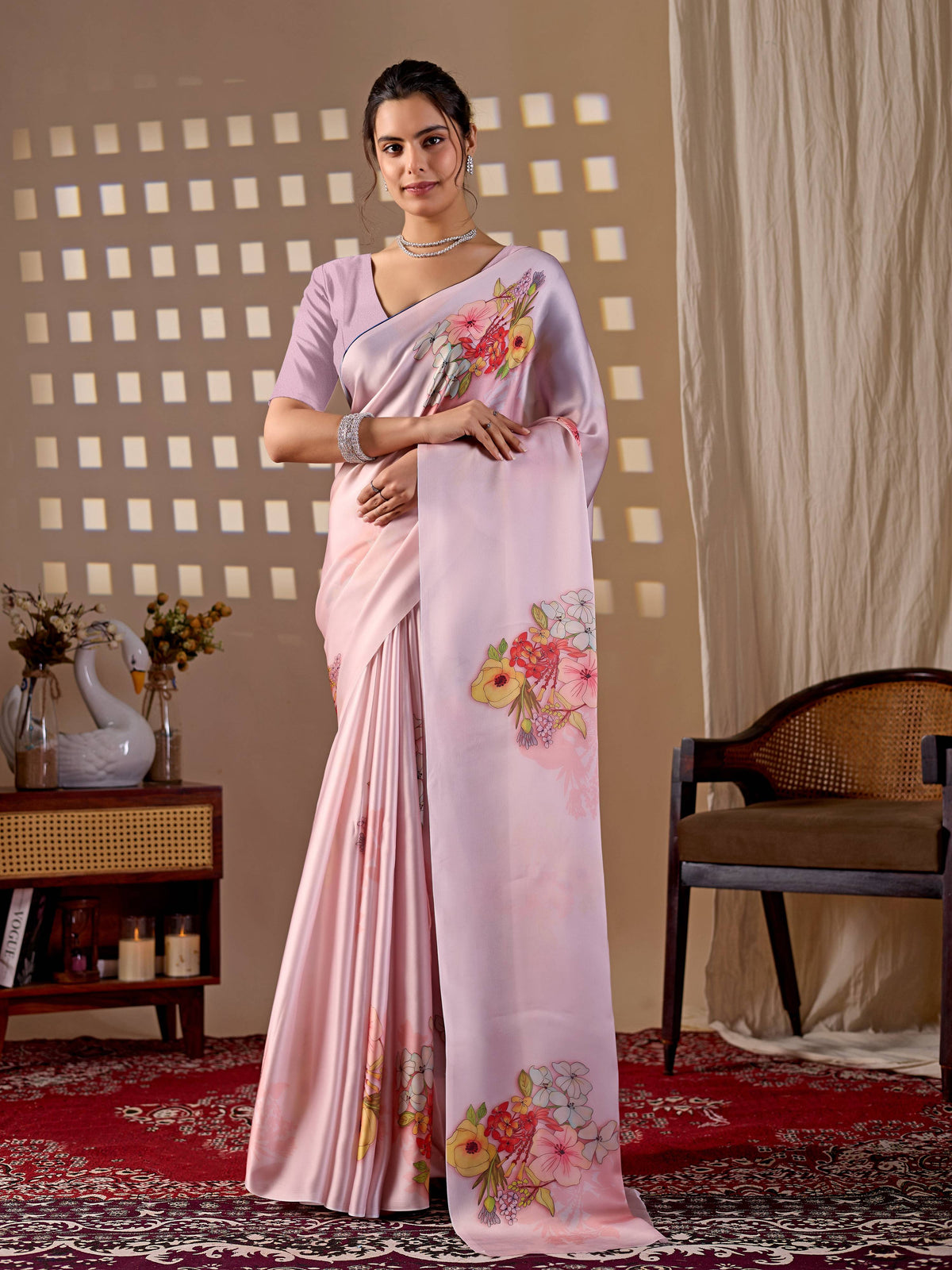 Light Pink soft satin georgette printed saree with a matching blouse.