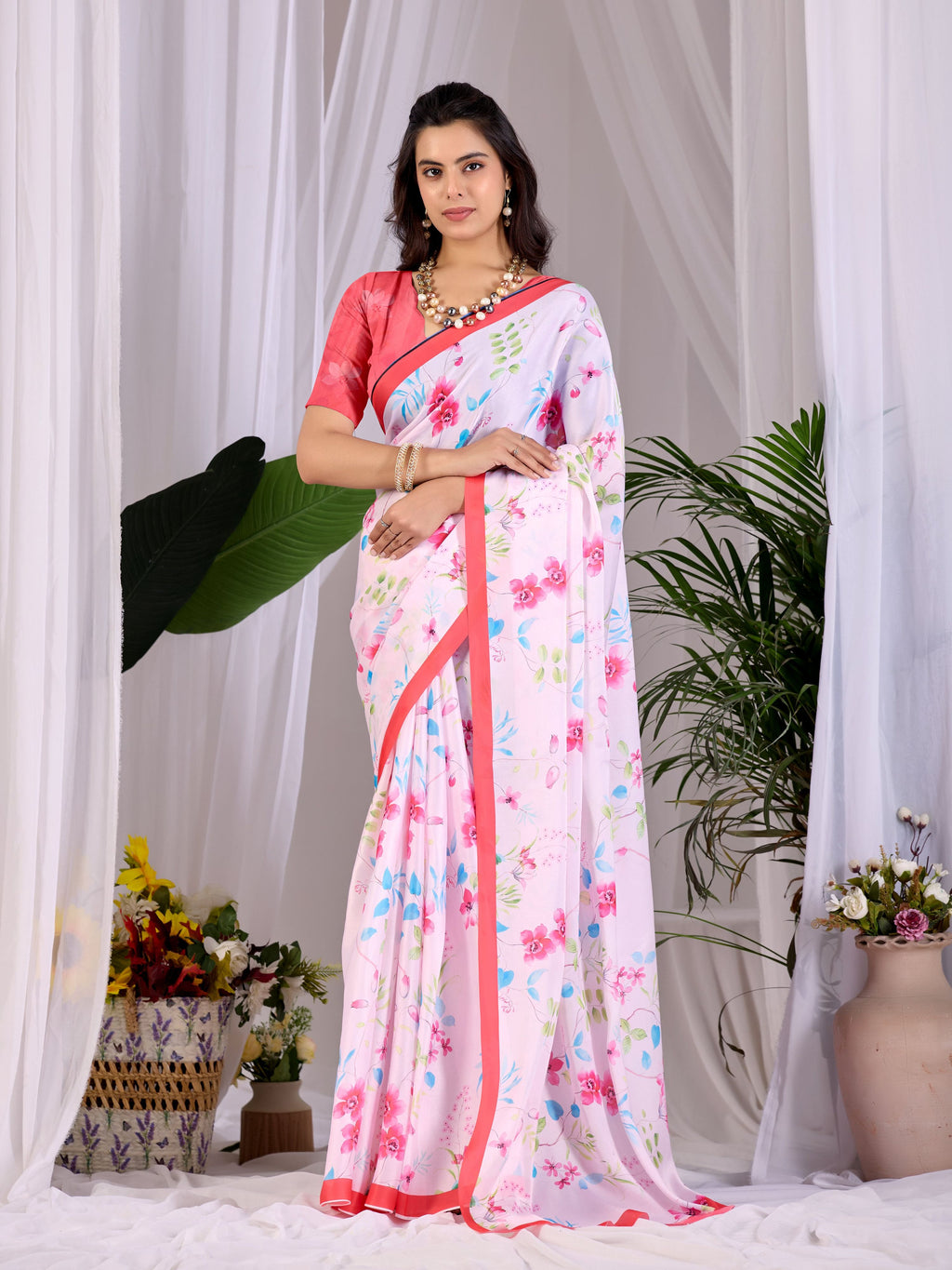 Aastha Fashion Pink Soft Satin Georgette Printed Saree with a red blouse piece draped elegantly.