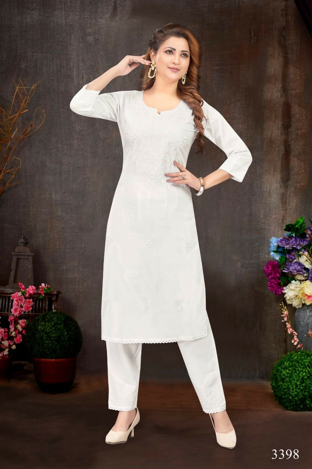 Minimalist white rayon kurta set with cotton lining for everyday wear.