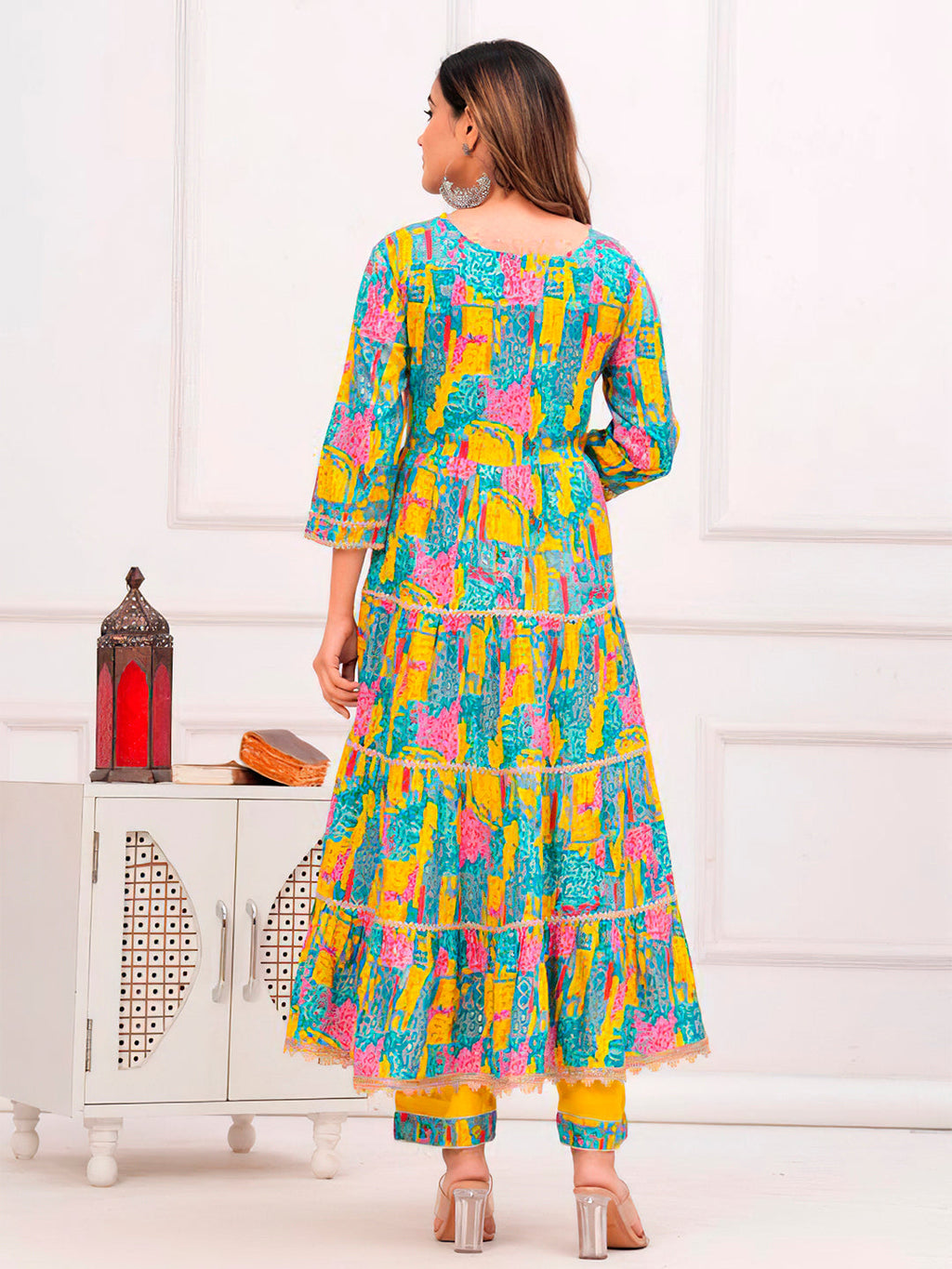 Multicoloured flared kurta with intricate embroidery and matching pant and dupatta set.