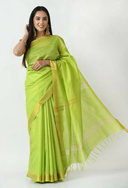 Parrot green Bhagalpuri handloom silk saree with golden Raj Shree detailing and unstitched blouse piece