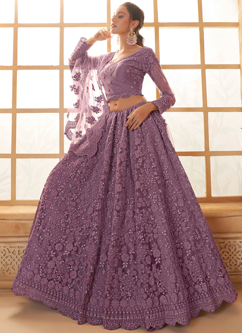Light purple net wedding lehenga with intricate thread work details