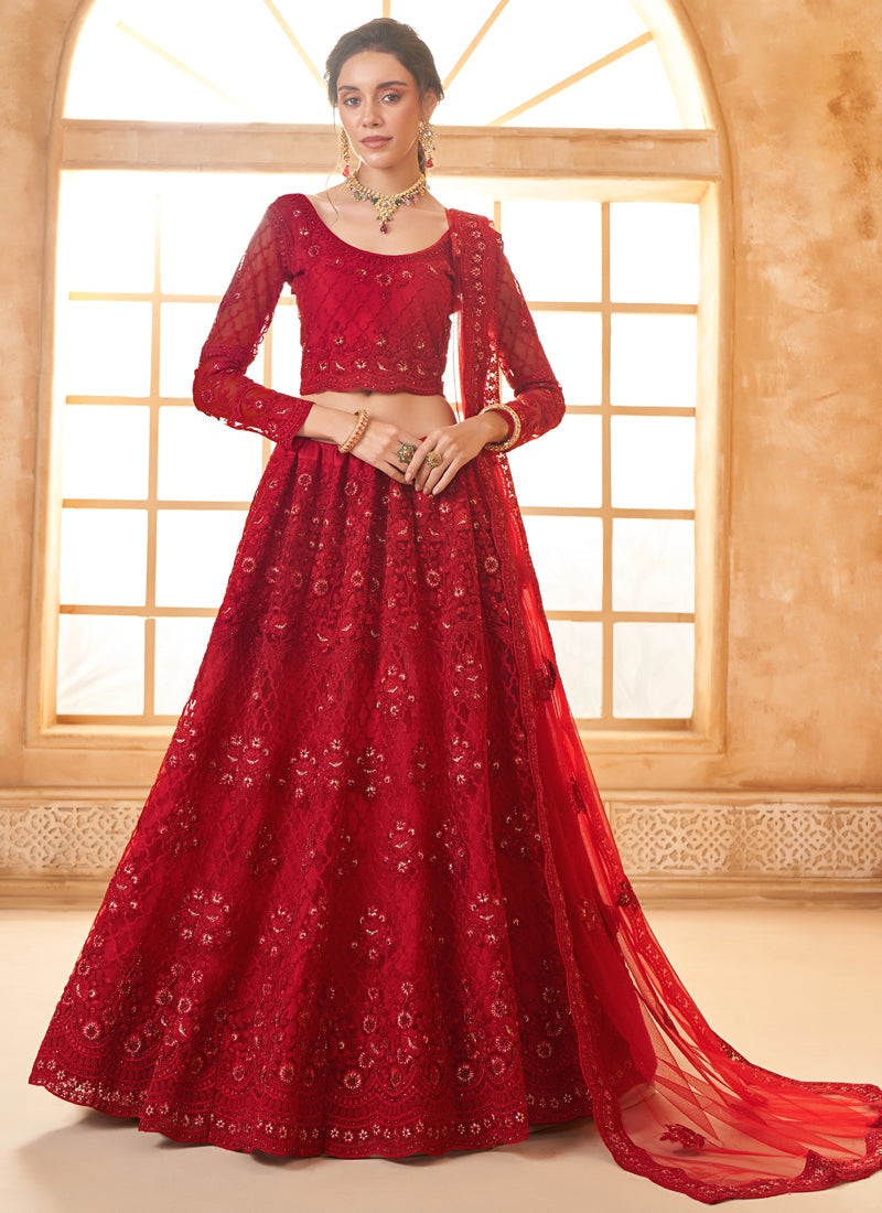 Traditional red net lehenga choli with detailed thread work for wedding