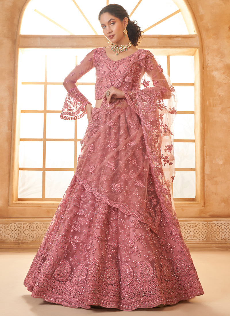 Peach net designer lehenga with elaborate embroidery