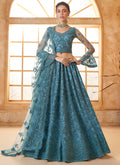 Aqua Blue net wedding lehenga with intricate thread work embroidery