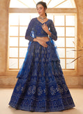 Deep blue net lehenga featuring detailed thread embroidery for wedding occasions