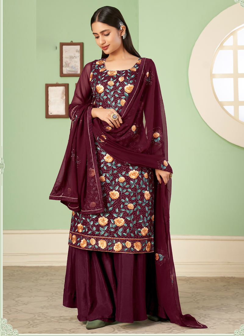 A maroon georgette A-line sharara suit with intricate embroidery