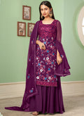 Woman wearing a violet floral embroidered chiffon A-line sharara suit with dupatta