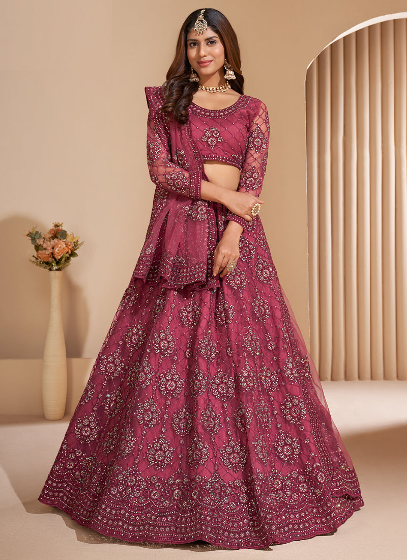 Pink net embroidered lehenga choli set with matching dupatta