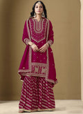 Woman wearing a Rani Pink Art Silk Palazzo Suit with intricate gota patti embroidery
