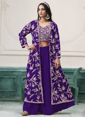 Woman wearing a violet floor-length faux georgette sharara suit with gold and lavender floral embroidery