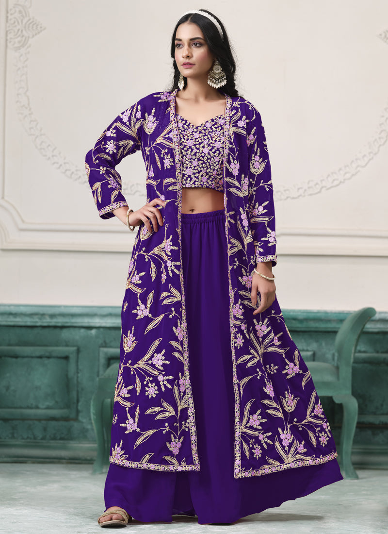 Woman wearing a violet floor-length faux georgette sharara suit with gold and lavender floral embroidery