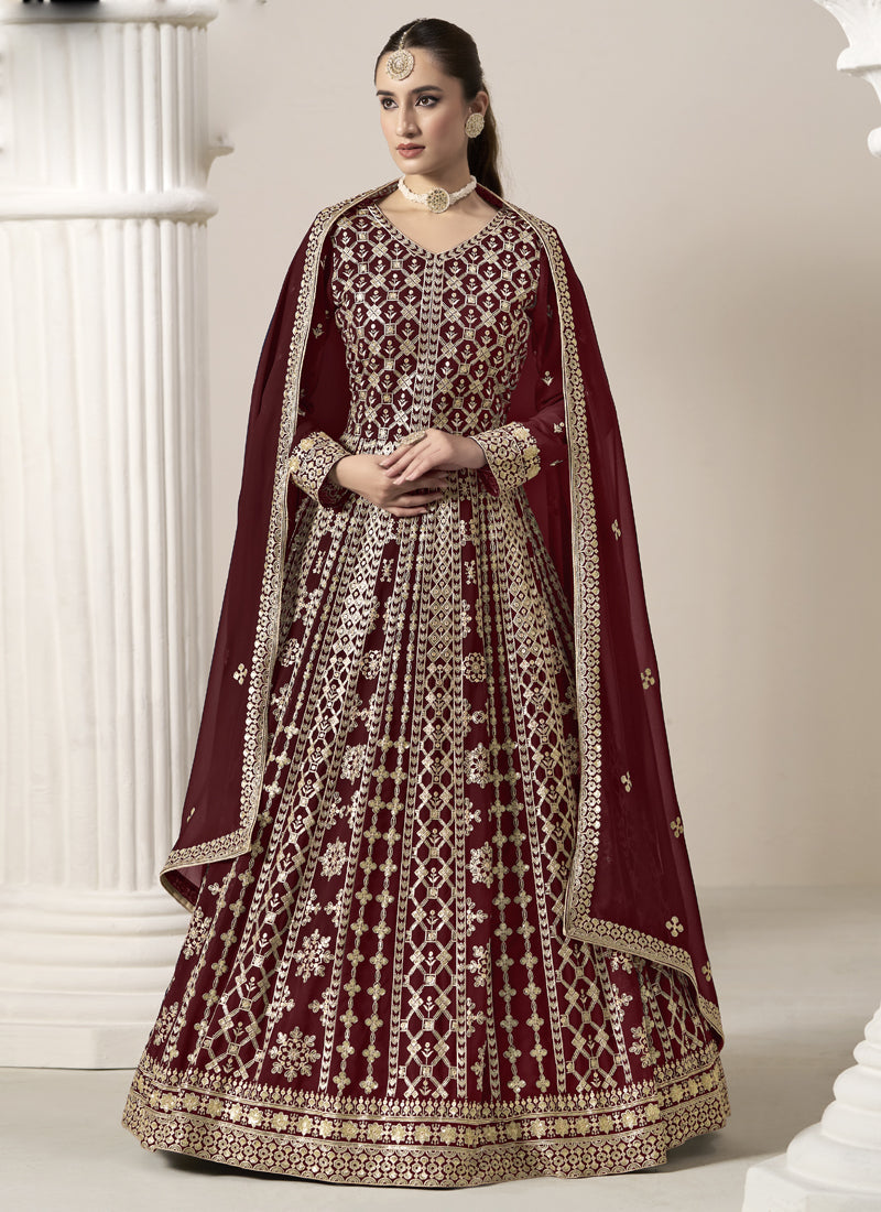 Maroon Faux Georgette Anarkali suit featuring ornate embroidery and gota patti